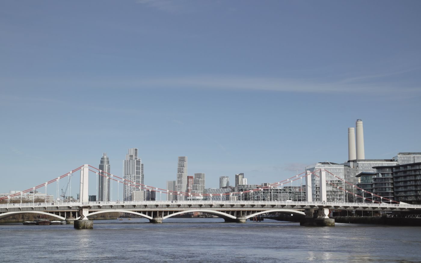 Chelsea Bridge over the Thames with Battersea Power Station on a sunny day